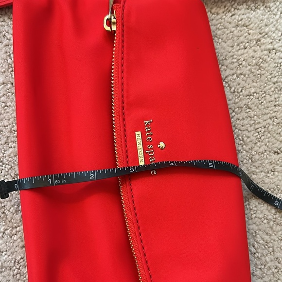 Kate Spade Red cross body purse. Fold over flap style. Zip pocket on front. - Picture 13 of 14